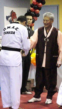 Receiving my Black Belt From Grand Master Kim
